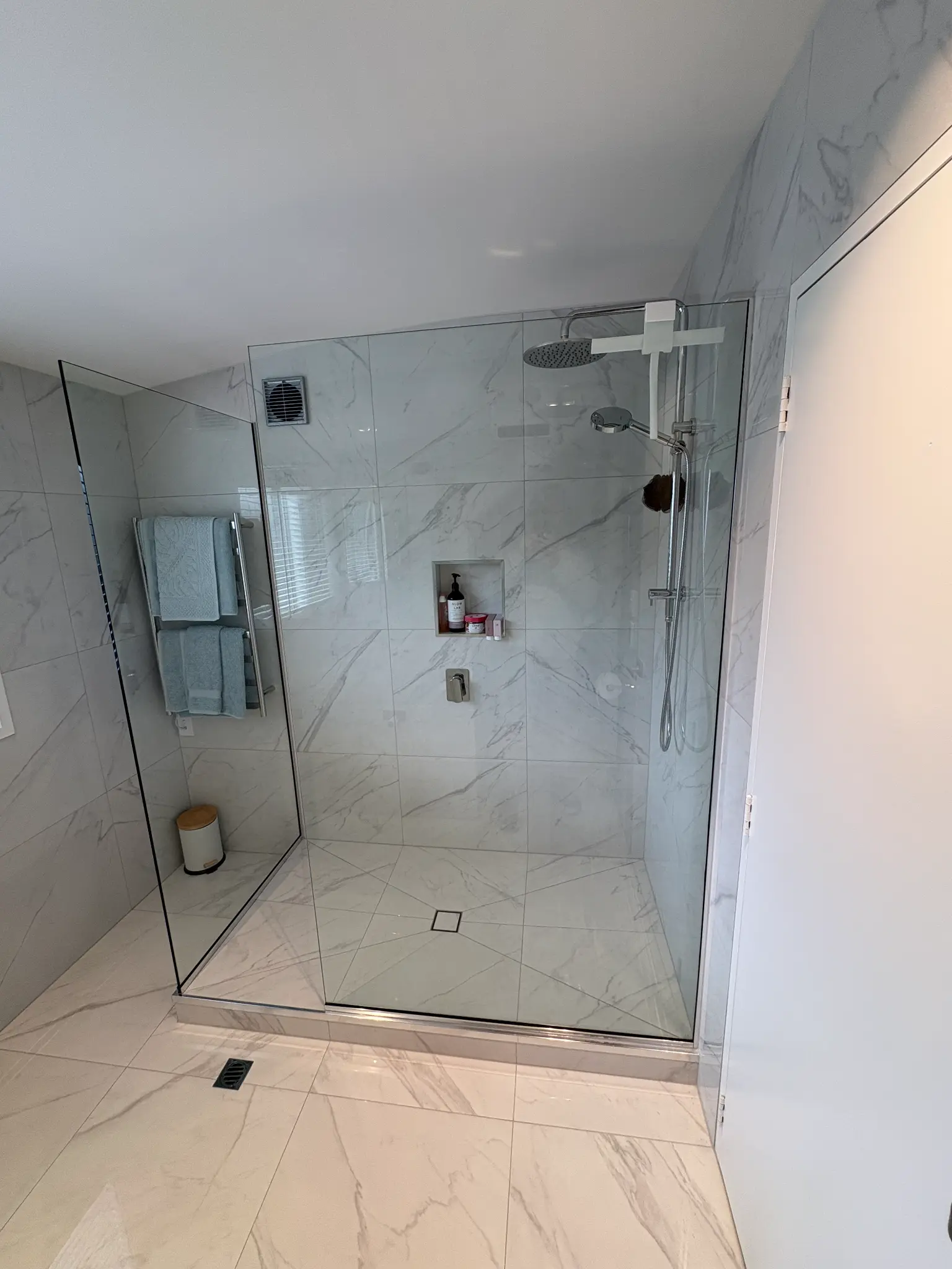 Completed tiled shower from an AA Bathrooms project